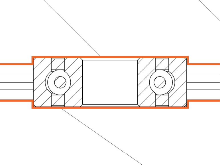 Diagram representing ball bearing surrounded by a mold with orange lines showing how the bearings are inset into the mold