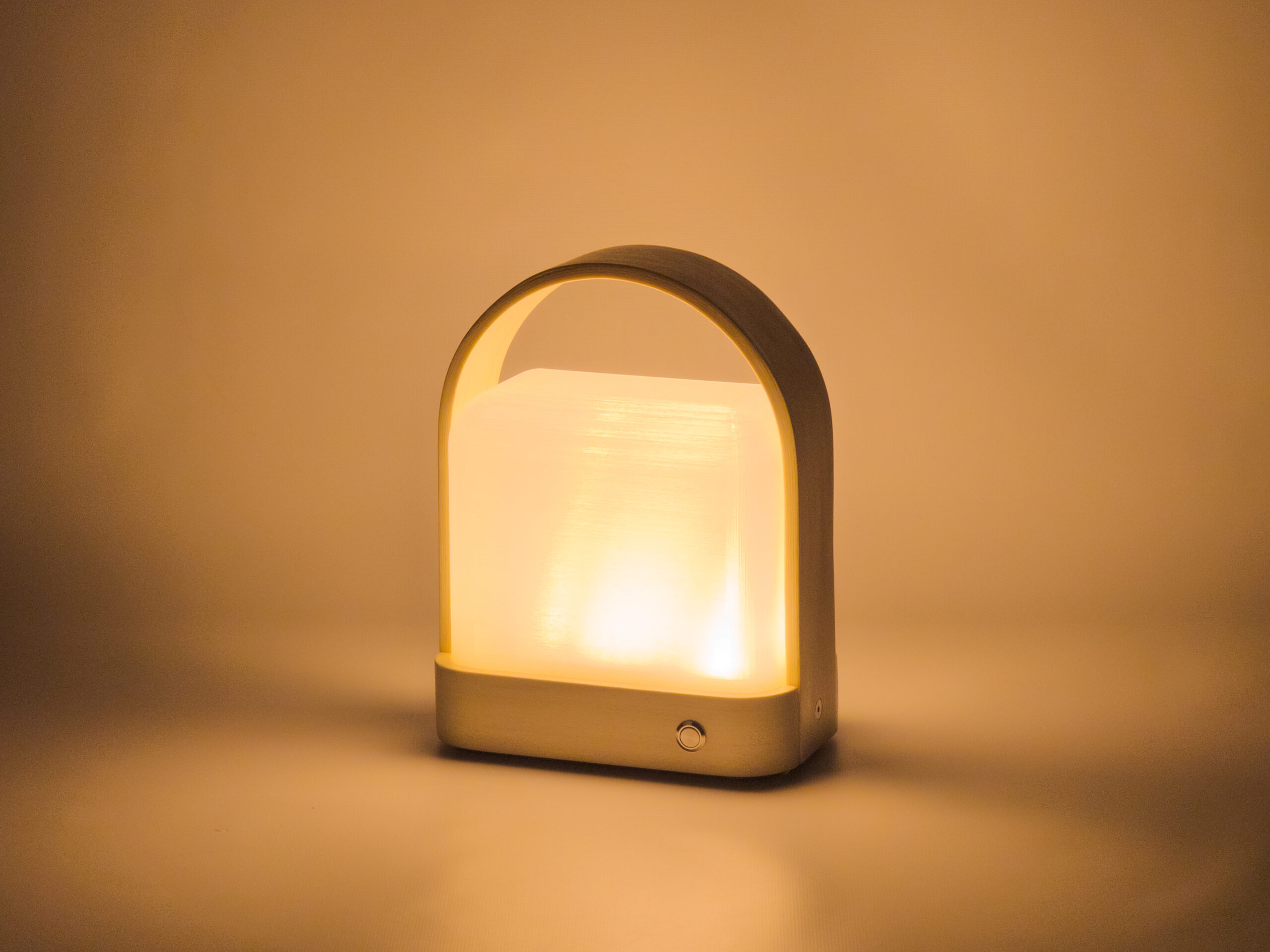 Wood and plastic lantern with curved handle against a white background, angled so front and right side are visible. Light is turned on with no other light source, so it glows in an otherwise dark image